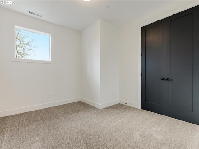 spare room with carpet floors