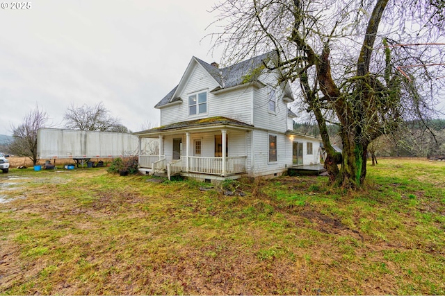 exterior space featuring a yard and a porch