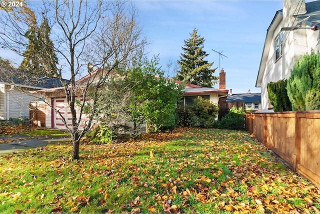 view of yard featuring a garage