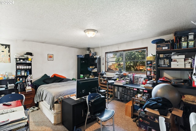 bedroom featuring carpet flooring and a textured ceiling