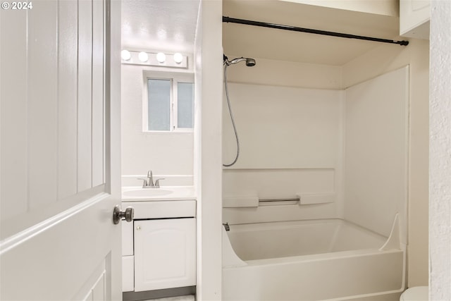 bathroom featuring shower / tub combination and vanity