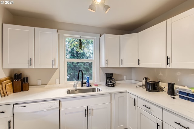 5108 NE Glisan St, Portland, OR 97213 - kitchen with dishwasher, a sink, and white cabinetry