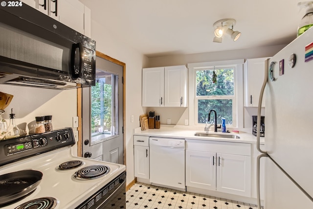 5108 NE Glisan St, Portland, OR 97213 - kitchen with white appliances, a sink, white cabinets, and light countertops