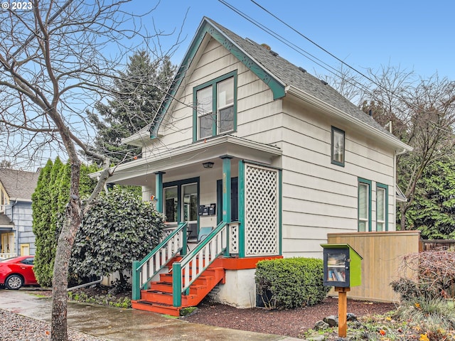 5108 NE Glisan St, Portland, OR 97213 - view of front of property with covered porch and a shingled roof