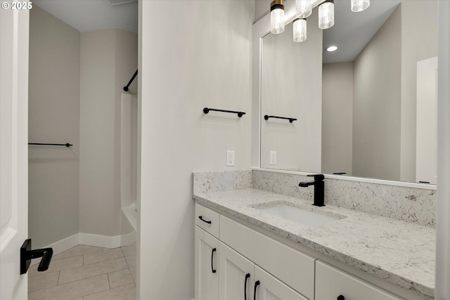 unfurnished bedroom featuring dark wood-type flooring, a closet, and baseboards