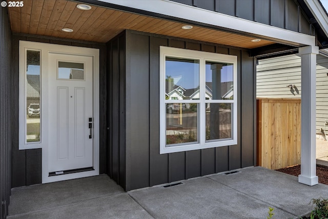 view of front of property with board and batten siding and a garage