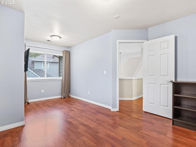 empty room featuring hardwood / wood-style floors