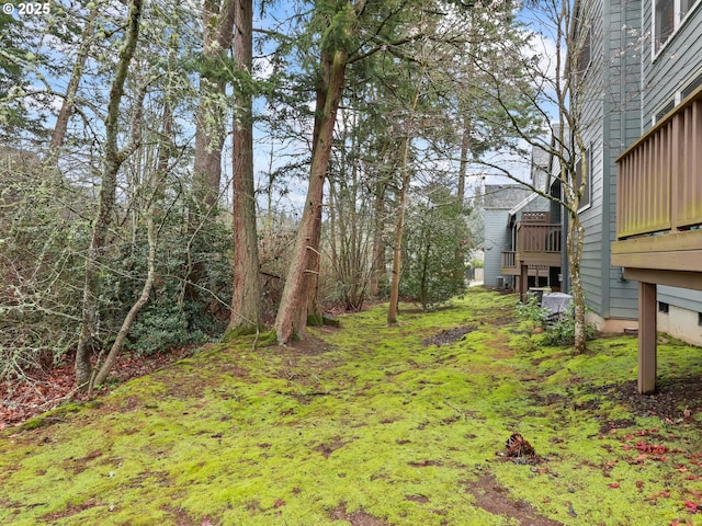 view of yard featuring a wooden deck