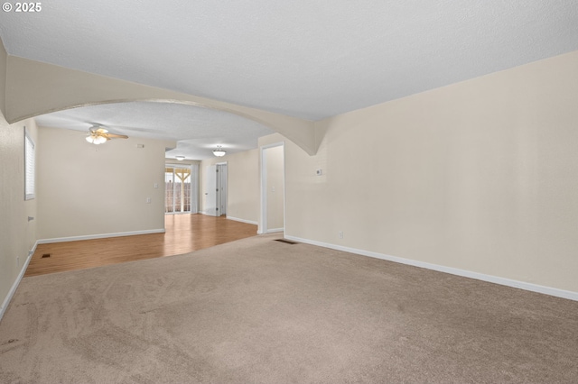 5706 NE 58th Ct, Vancouver, WA 98661 - carpeted spare room with arched walkways and a ceiling fan