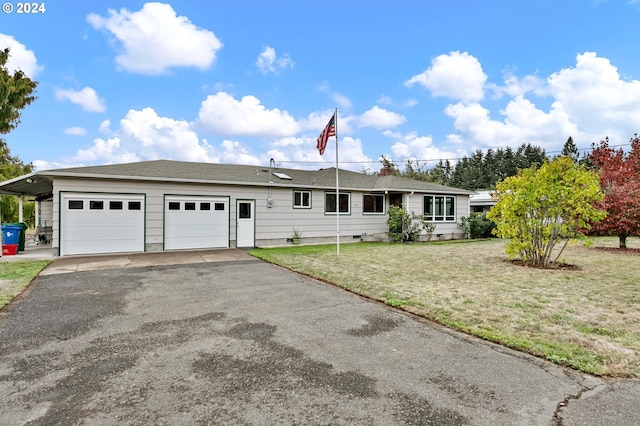 single story home featuring a front yard, aphalt driveway, and an attached garage