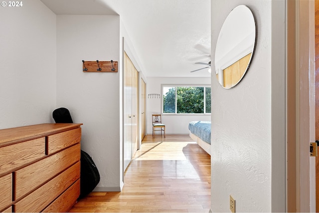 bedroom featuring ceiling fan and light wood-type flooring