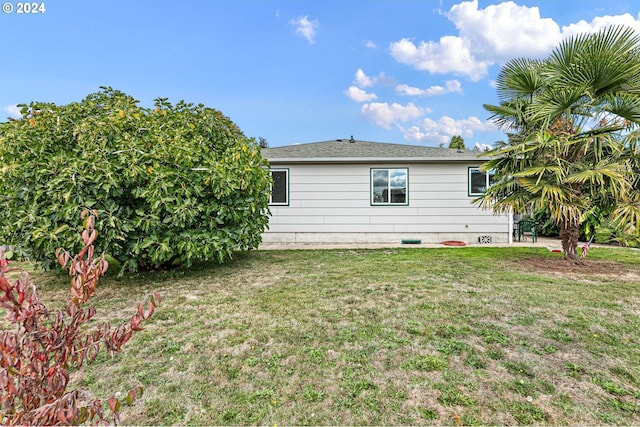 view of property exterior featuring a yard