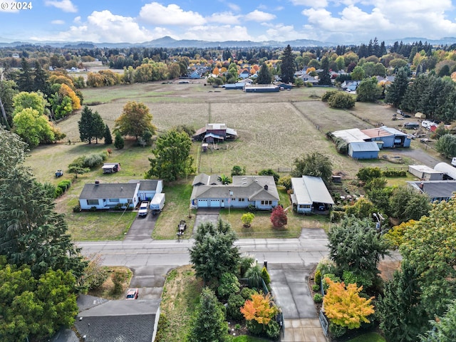 birds eye view of property featuring a rural view and a mountain view