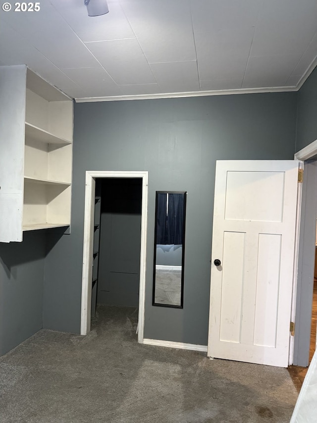 carpeted spare room featuring ornamental molding