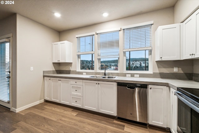 kitchen featuring appliances with stainless steel finishes, a healthy amount of sunlight, and sink