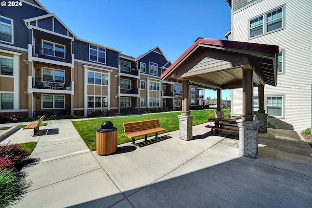 view of property's community with a gazebo and a yard