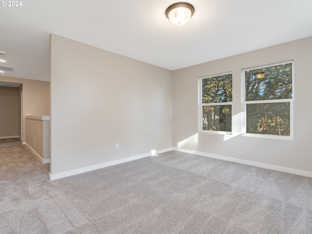 empty room with light colored carpet