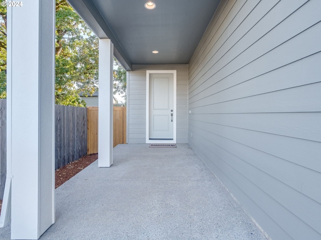 property entrance with a patio area