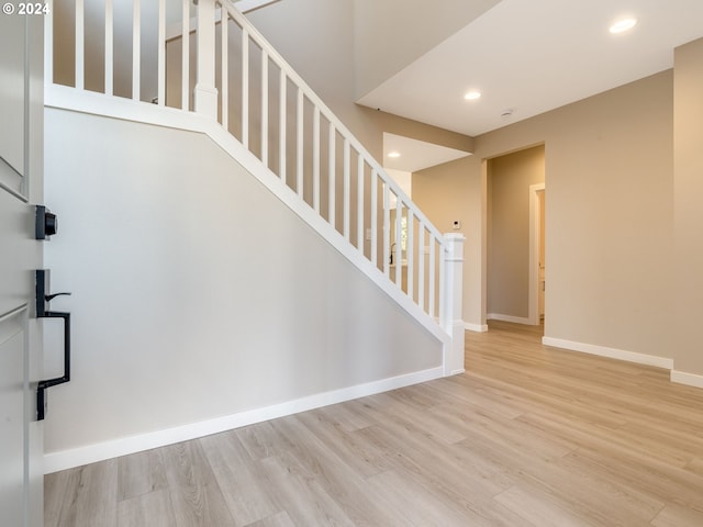 stairway featuring hardwood / wood-style floors