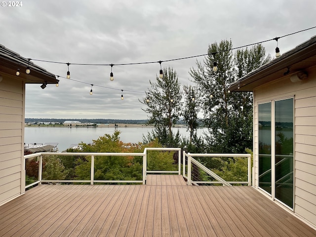 wooden deck with a water view