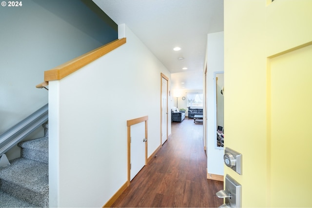 corridor featuring dark wood-type flooring