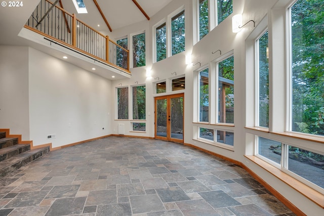 unfurnished room featuring light colored carpet and a textured ceiling