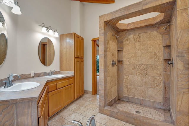 laundry area with light tile patterned floors, washing machine and clothes dryer, and cabinets