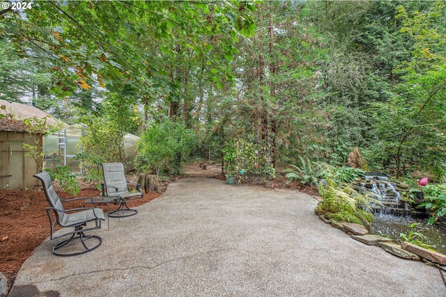 rear view of property featuring a wooden deck and central AC