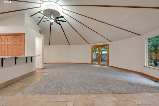 unfurnished living room with lofted ceiling, light carpet, and ceiling fan