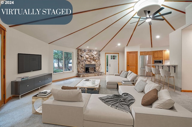 unfurnished living room featuring light carpet, vaulted ceiling, ceiling fan, and a fireplace