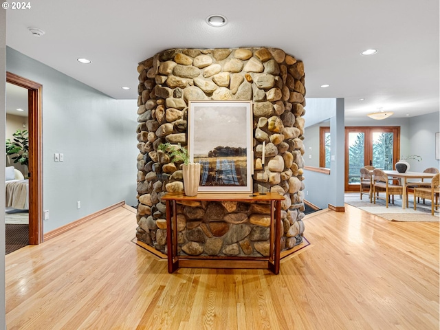 living room with a fireplace and hardwood / wood-style flooring