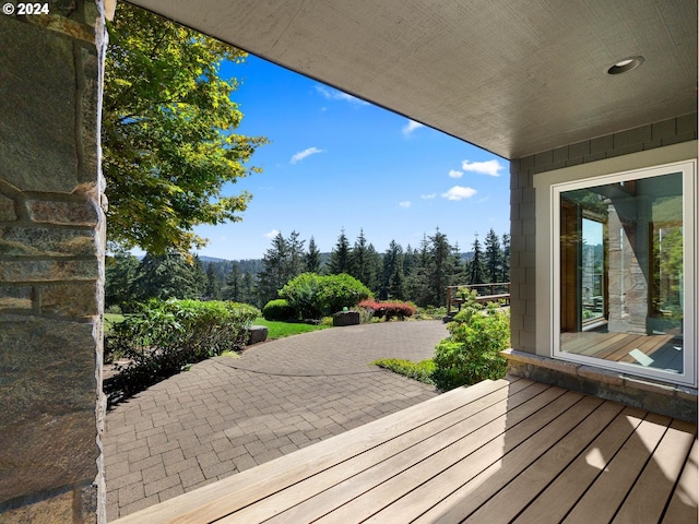 wooden deck with a patio