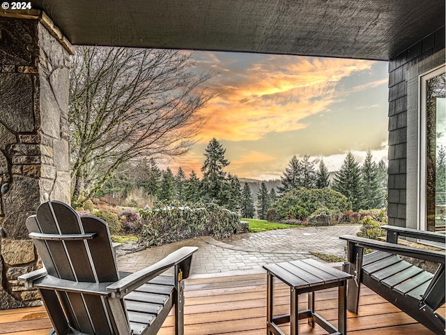 deck at dusk with a patio area