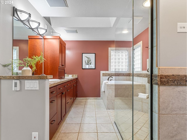 bathroom featuring tile patterned floors, vanity, a textured ceiling, and shower with separate bathtub