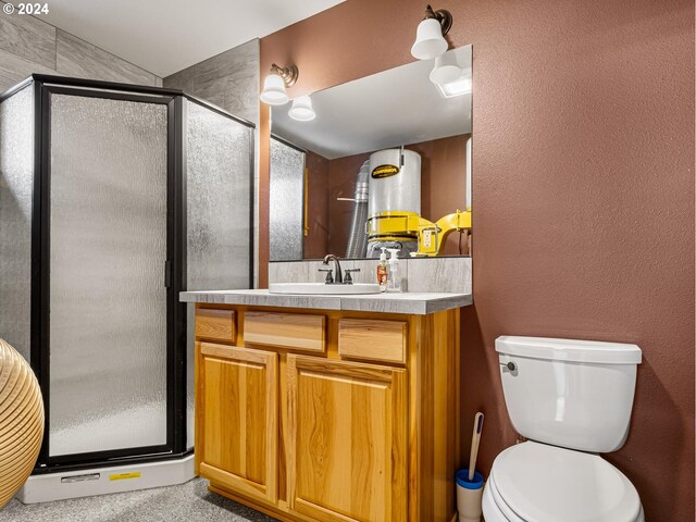 bathroom featuring vanity, toilet, and walk in shower