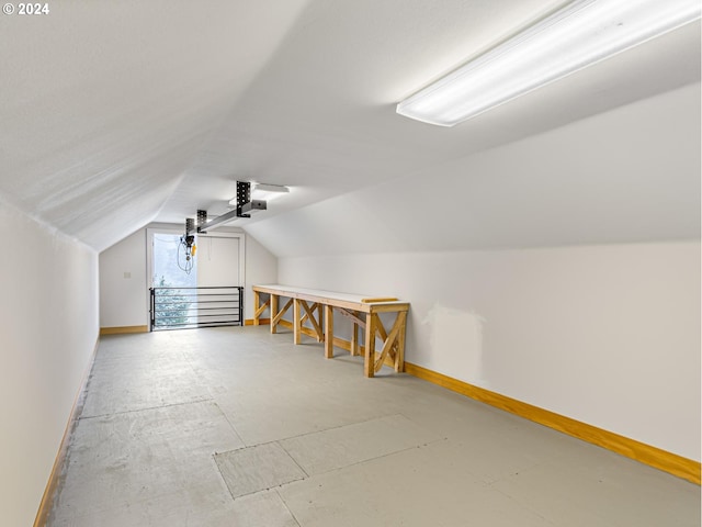 bonus room featuring vaulted ceiling