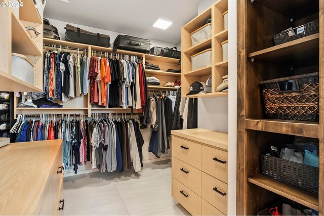 walk in closet featuring light tile patterned floors