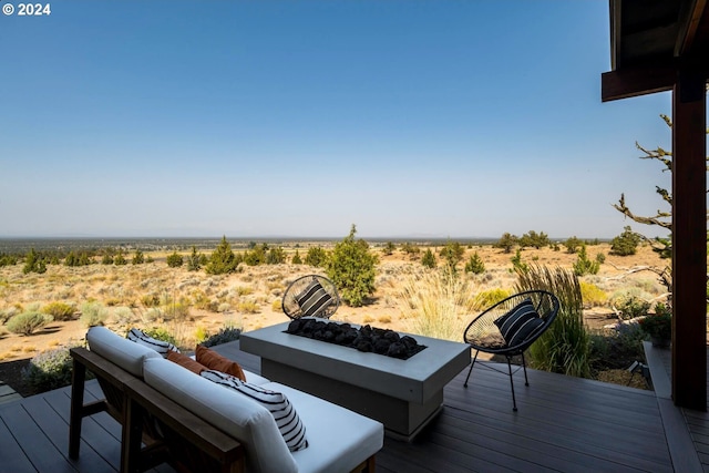 wooden deck featuring a fire pit