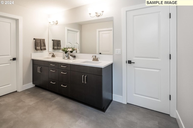 bathroom featuring vanity and concrete floors