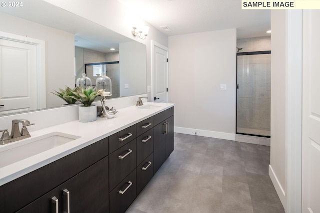 bathroom with vanity, an enclosed shower, and concrete floors