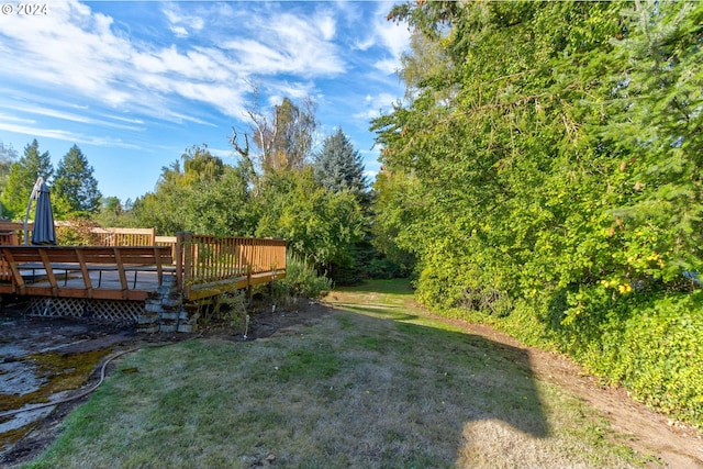 view of yard with a deck