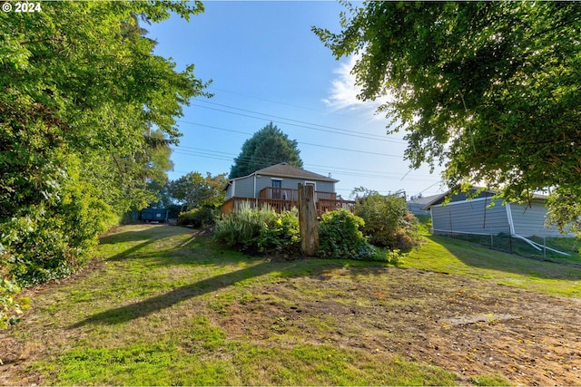 view of yard with a wooden deck