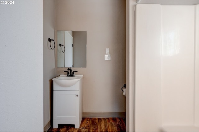 bathroom featuring hardwood / wood-style flooring and vanity