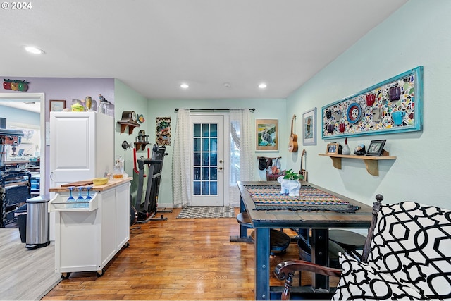 kitchen with light wood-style floors, white cabinetry, light countertops, and recessed lighting