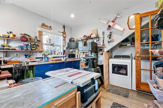 kitchen featuring blue cabinets, recessed lighting, light wood-style floors, open shelves, and washer / clothes dryer