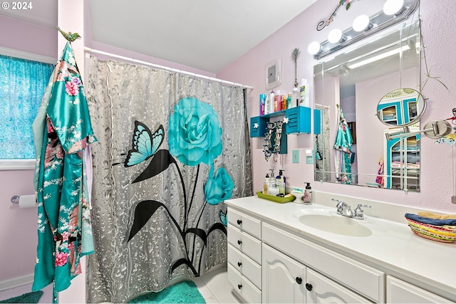 full bath featuring tile patterned flooring and vanity