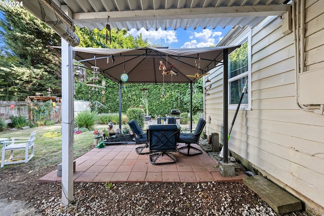 view of patio / terrace featuring fence and a gazebo