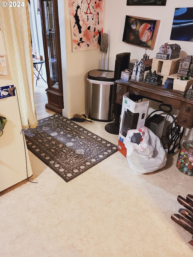 interior space featuring carpet and baseboards