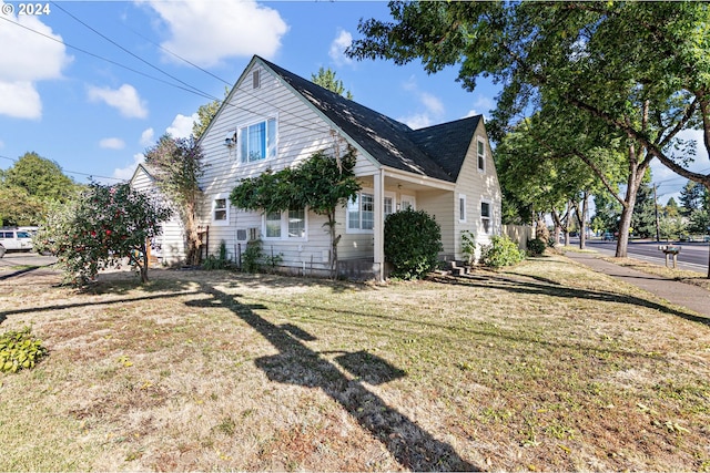 view of property exterior with a yard