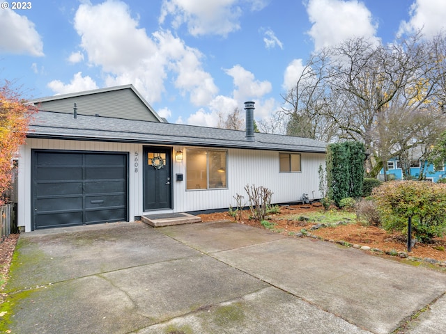 single story home featuring a garage